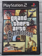 A PlayStation 2 game case for Grand Theft Auto: San Andreas, photographed standing upright against a light gray textured background.