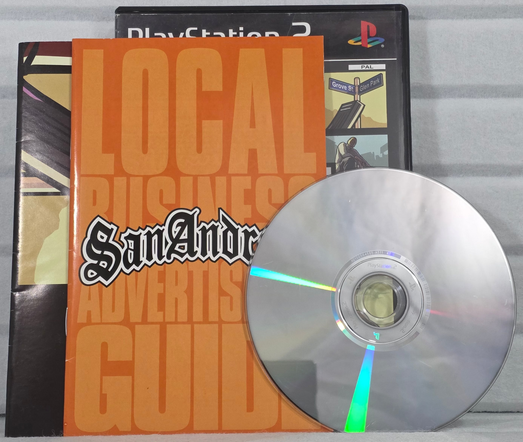 A PlayStation 3 game case for 'Local Business Advertisers Guide' with a silver disc in front, displayed on a light gray textured surface.